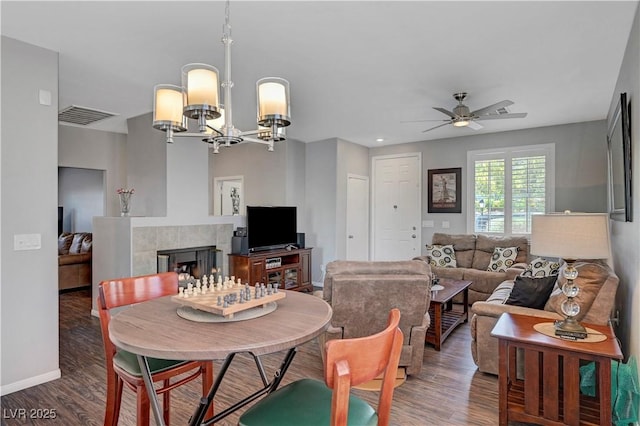 4020 Driscoll Mountain St, Las Vegas, NV 89129 - dining space featuring wood finished floors, a chandelier, ceiling fan, and baseboards