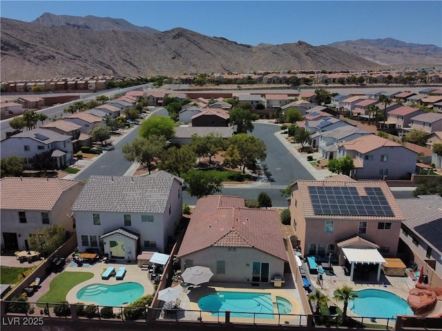 4020 Driscoll Mountain St, Las Vegas, NV 89129 - aerial perspective of suburban area featuring a pool and a mountainous background