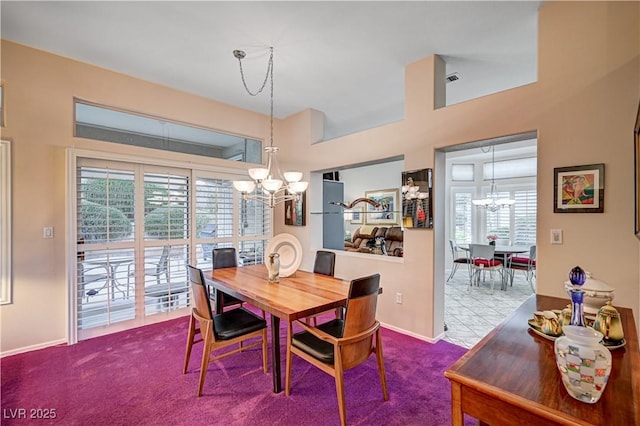 2801 Byron Dr, Las Vegas, NV 89134 - carpeted dining space featuring a chandelier, healthy amount of natural light, and baseboards