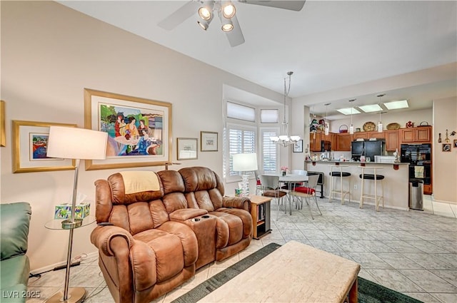 2801 Byron Dr, Las Vegas, NV 89134 - living room with ceiling fan, a chandelier, and baseboards