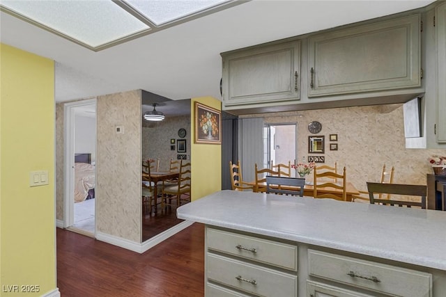 3815 Atlantis St, Las Vegas, NV 89121 - kitchen with dark wood-style floors, gray cabinets, baseboards, and light countertops