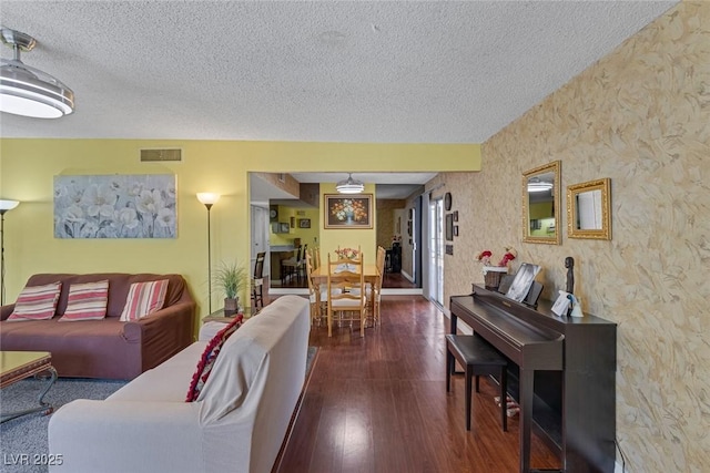 3815 Atlantis St, Las Vegas, NV 89121 - living area featuring a textured ceiling and dark wood-style floors