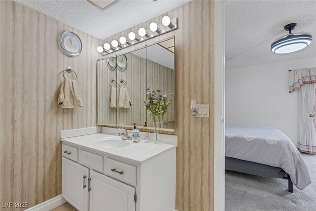 3815 Atlantis St, Las Vegas, NV 89121 - ensuite bathroom featuring a textured ceiling and vanity