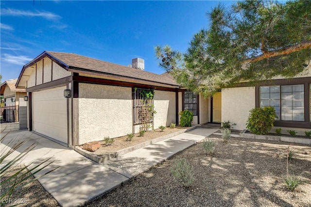 6521 Faith Peak Dr, Las Vegas, NV 89108 - view of front of house featuring a garage, stucco siding, concrete driveway, and roof with shingles