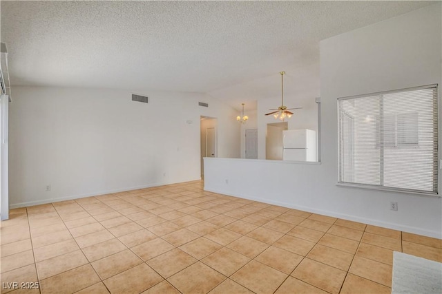 6521 Faith Peak Dr, Las Vegas, NV 89108 - unfurnished room with vaulted ceiling, light tile patterned floors, a textured ceiling, ceiling fan, and a chandelier