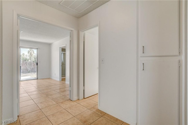 6521 Faith Peak Dr, Las Vegas, NV 89108 - hallway featuring light tile patterned floors and baseboards