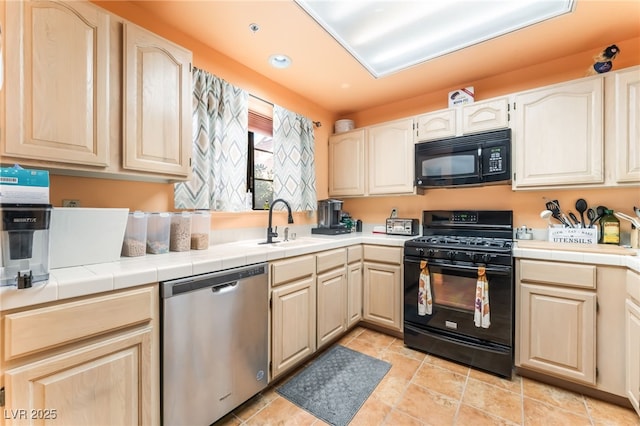 2851 S Valley View Blvd Unit 1071, Las Vegas, NV 89102 - kitchen with black appliances, a sink, tile countertops, recessed lighting, and light brown cabinetry