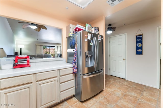 2851 S Valley View Blvd Unit 1071, Las Vegas, NV 89102 - kitchen with stainless steel fridge with ice dispenser, ceiling fan, tile countertops, and open floor plan
