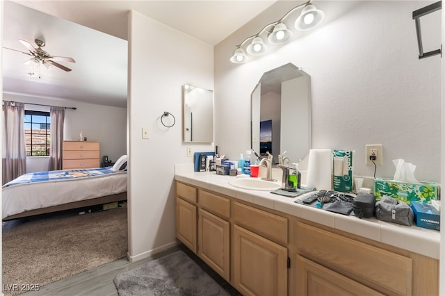 2851 S Valley View Blvd Unit 1071, Las Vegas, NV 89102 - ensuite bathroom featuring vanity, ceiling fan, and wood finished floors