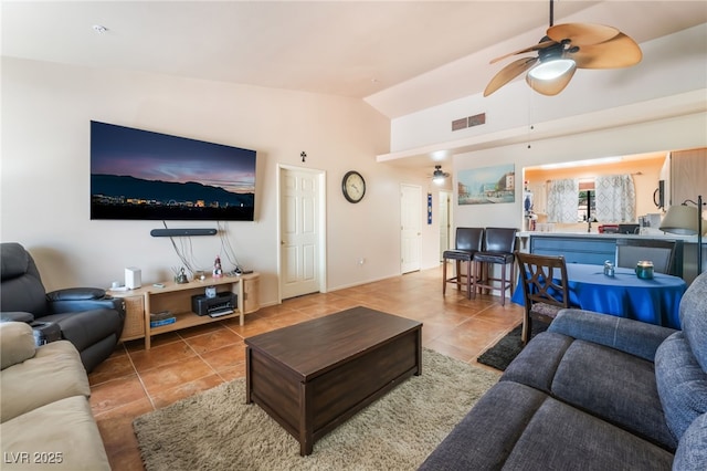 2851 S Valley View Blvd Unit 1071, Las Vegas, NV 89102 - living area with tile patterned flooring, vaulted ceiling, and ceiling fan