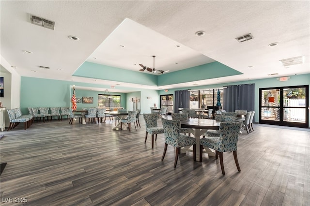 2851 S Valley View Blvd Unit 1071, Las Vegas, NV 89102 - dining area with wood finished floors, a tray ceiling, a textured ceiling, and recessed lighting