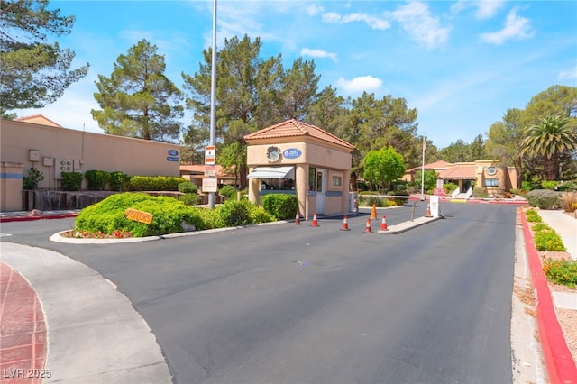 2851 S Valley View Blvd Unit 1071, Las Vegas, NV 89102 - view of asphalt street featuring sidewalks, curbs, and a gated entry
