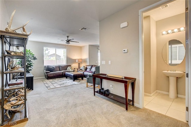 9846 Sunriver Meadows Ave, Las Vegas, NV 89148 - living room featuring carpet flooring, ceiling fan, and baseboards