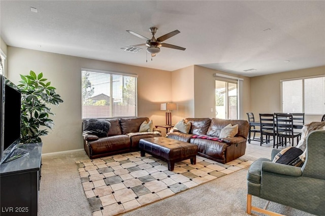 9846 Sunriver Meadows Ave, Las Vegas, NV 89148 - living room featuring light colored carpet, a ceiling fan, and baseboards