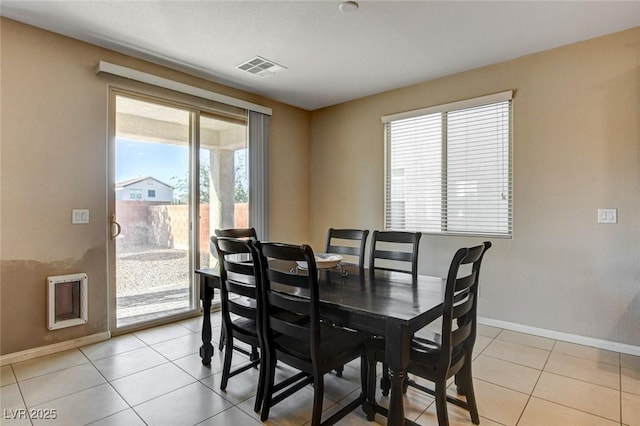 9846 Sunriver Meadows Ave, Las Vegas, NV 89148 - dining area with baseboards and light tile patterned flooring