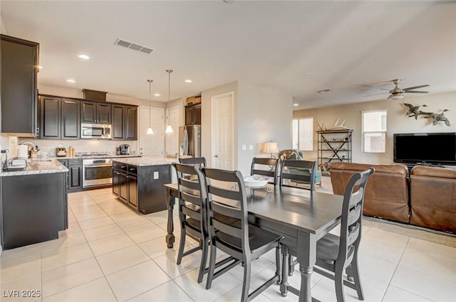 9846 Sunriver Meadows Ave, Las Vegas, NV 89148 - dining space featuring light tile patterned flooring, ceiling fan, and recessed lighting
