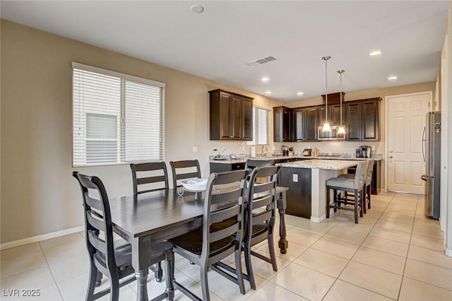 9846 Sunriver Meadows Ave, Las Vegas, NV 89148 - dining room featuring light tile patterned floors, baseboards, and recessed lighting