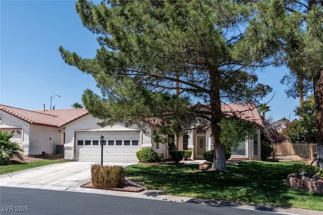 4904 Wiltondale Way, Las Vegas, NV 89130 - view of front of property featuring a tiled roof, an attached garage, concrete driveway, and stucco siding