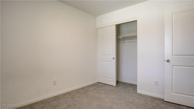 4229 Venus Falls Ave, North Las Vegas, NV 89084 - unfurnished bedroom featuring light carpet, baseboards, and a closet
