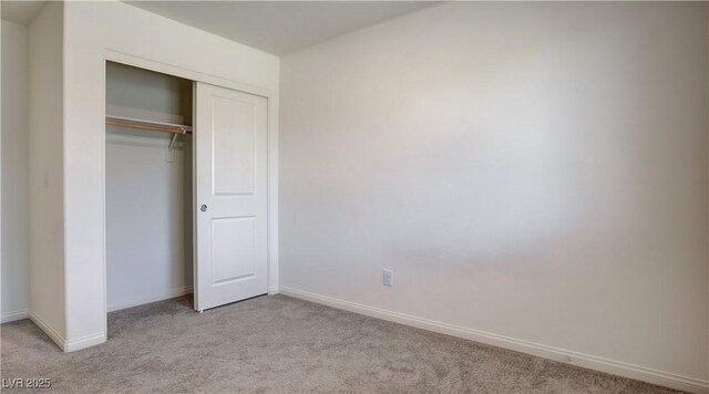 4229 Venus Falls Ave, North Las Vegas, NV 89084 - unfurnished bedroom featuring light carpet, baseboards, and a closet