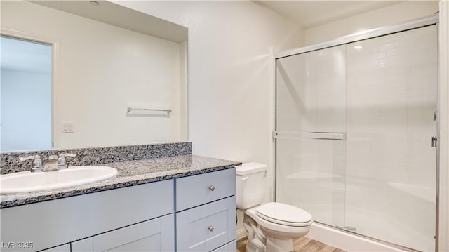 4229 Venus Falls Ave, North Las Vegas, NV 89084 - full bathroom with vanity, toilet, a stall shower, and wood finished floors