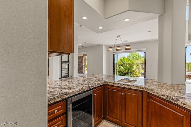 2436 Grassy Spring Pl, Las Vegas, NV 89135 - kitchen featuring beverage cooler, light stone countertops, recessed lighting, and a peninsula
