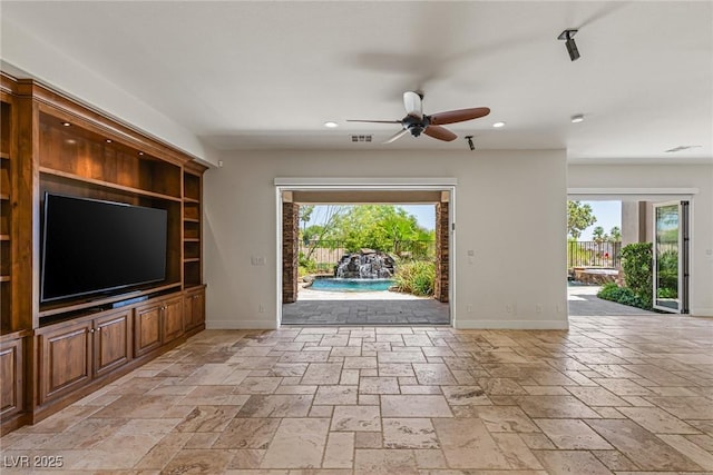 2436 Grassy Spring Pl, Las Vegas, NV 89135 - unfurnished living room with healthy amount of natural light, recessed lighting, a ceiling fan, and stone tile flooring