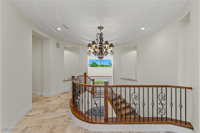 2436 Grassy Spring Pl, Las Vegas, NV 89135 - corridor featuring a chandelier, recessed lighting, stone finish floors, and an upstairs landing