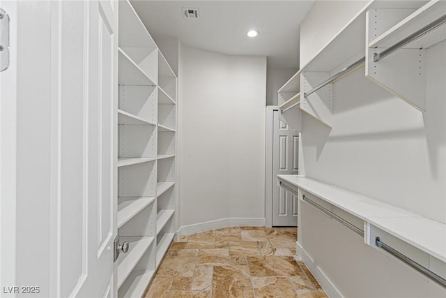 2436 Grassy Spring Pl, Las Vegas, NV 89135 - spacious closet with light stone finish floors