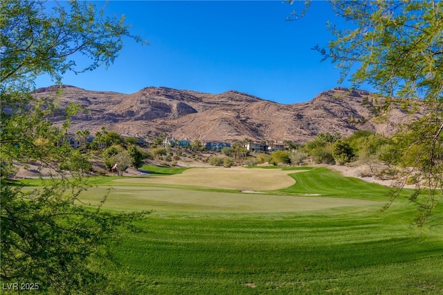 2436 Grassy Spring Pl, Las Vegas, NV 89135 - view of community with view of golf course, a lawn, and a mountain view
