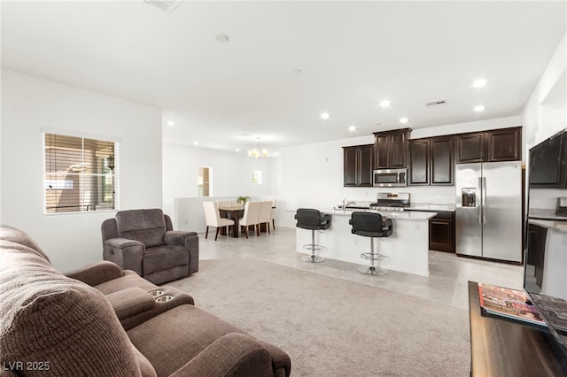 2495 Sunflower Days Ave Unit 2052, North Las Vegas, NV 89031 - living area with a chandelier, recessed lighting, healthy amount of natural light, and light tile patterned floors