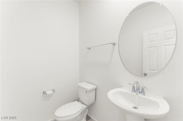 2495 Sunflower Days Ave Unit 2052, North Las Vegas, NV 89031 - bathroom with a sink, baseboards, and toilet