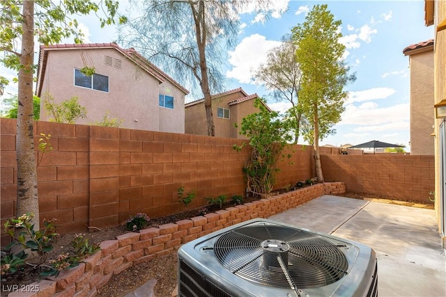 7923 Homer Ct, Las Vegas, NV 89139 - fenced backyard with cooling unit and a patio area
