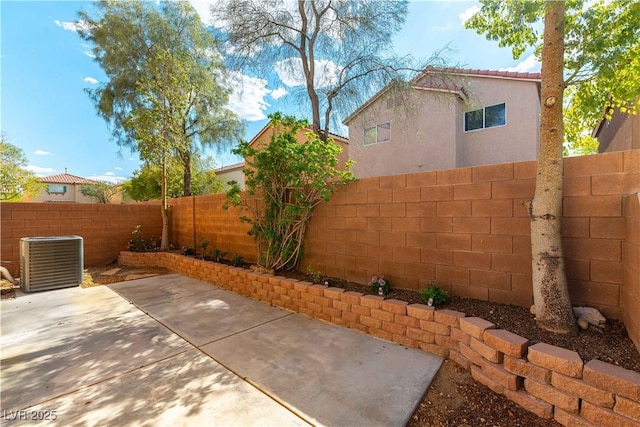 7923 Homer Ct, Las Vegas, NV 89139 - fenced backyard with cooling unit and a patio