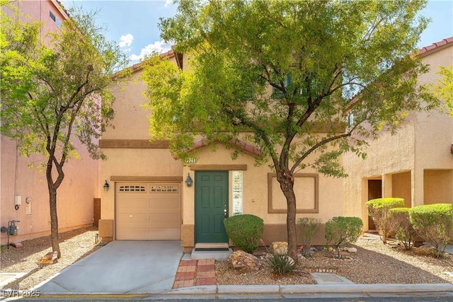 7923 Homer Ct, Las Vegas, NV 89139 - view of front of property with stucco siding, a garage, and concrete driveway