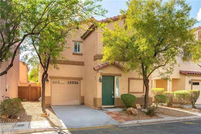 7923 Homer Ct, Las Vegas, NV 89139 - view of front facade featuring a tiled roof, a garage, driveway, and stucco siding