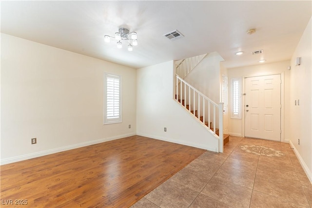 7923 Homer Ct, Las Vegas, NV 89139 - entrance foyer with stairs, healthy amount of natural light, light tile patterned floors, baseboards, and recessed lighting