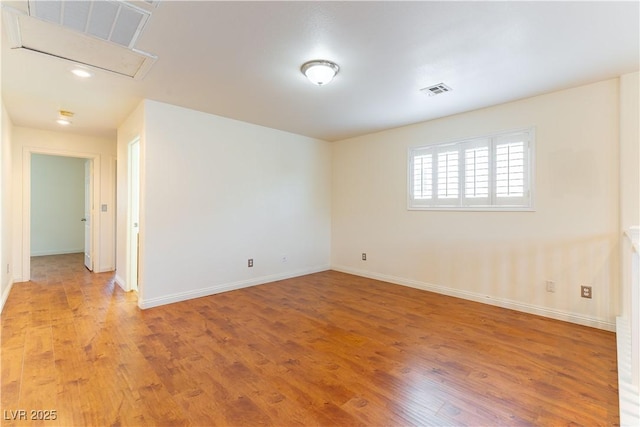 7923 Homer Ct, Las Vegas, NV 89139 - spare room with baseboards, light wood-style flooring, attic access, and recessed lighting
