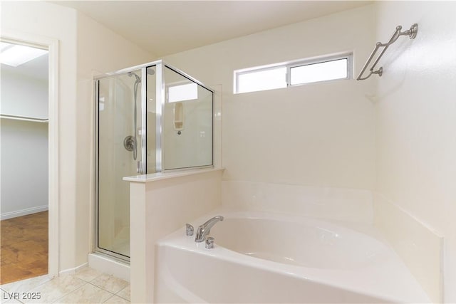 7923 Homer Ct, Las Vegas, NV 89139 - full bath with a stall shower, a garden tub, and a walk in closet