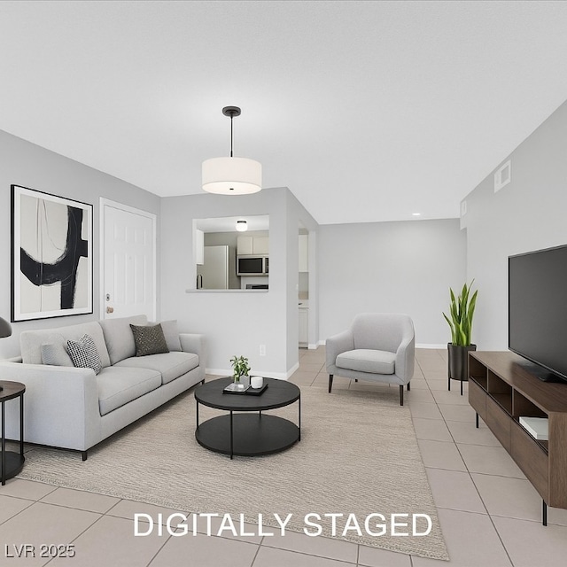 230 Mission Newport Ln Unit 104, Las Vegas, NV 89107 - living area featuring light tile patterned floors and baseboards