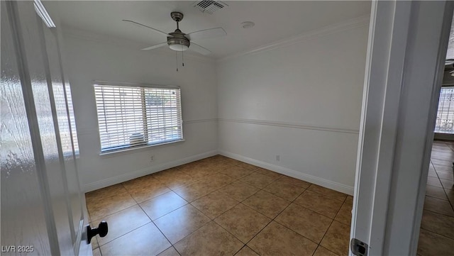 3020 Wilmington Way, Las Vegas, NV 89102 - unfurnished room featuring plenty of natural light, a ceiling fan, tile patterned flooring, ornamental molding, and baseboards