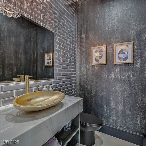 5400 Mello Ave, Las Vegas, NV 89131 - half bathroom featuring toilet and a sink