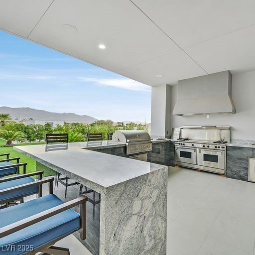 5400 Mello Ave, Las Vegas, NV 89131 - view of patio / terrace featuring exterior kitchen and a mountain view