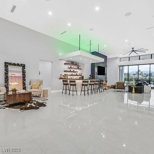 5400 Mello Ave, Las Vegas, NV 89131 - living room with a high ceiling, recessed lighting, and a community bar