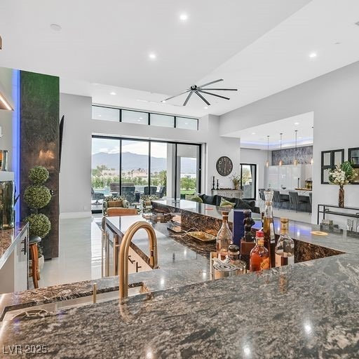 5400 Mello Ave, Las Vegas, NV 89131 - kitchen featuring open floor plan, dark stone counters, and recessed lighting