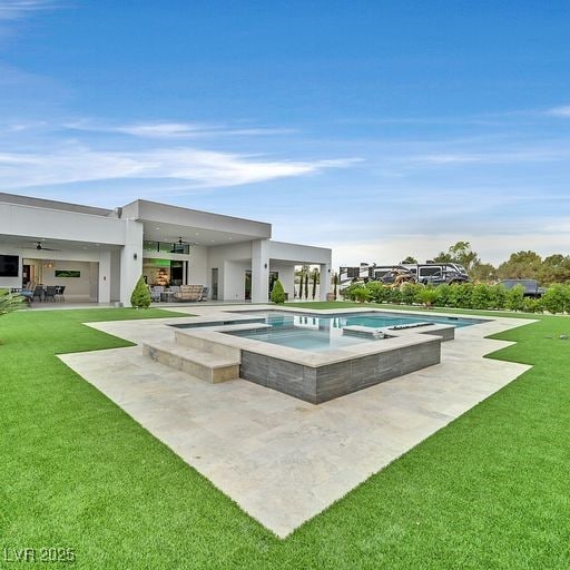 5400 Mello Ave, Las Vegas, NV 89131 - view of pool with a patio, a ceiling fan, a lawn, and a pool with connected hot tub