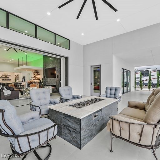 5400 Mello Ave, Las Vegas, NV 89131 - view of patio with an outdoor living space with a fire pit