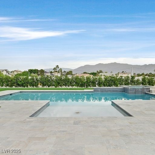 5400 Mello Ave, Las Vegas, NV 89131 - outdoor pool featuring a mountain view and a patio