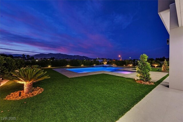 5400 Mello Ave, Las Vegas, NV 89131 - swimming pool featuring a lawn, a patio, and a mountain view