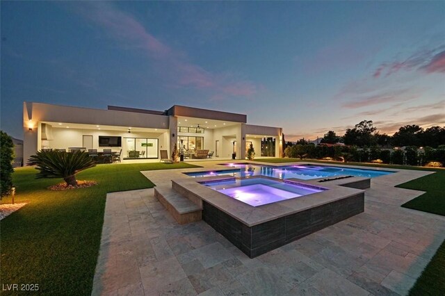 5400 Mello Ave, Las Vegas, NV 89131 - view of pool with a patio area, a lawn, and a pool with connected hot tub